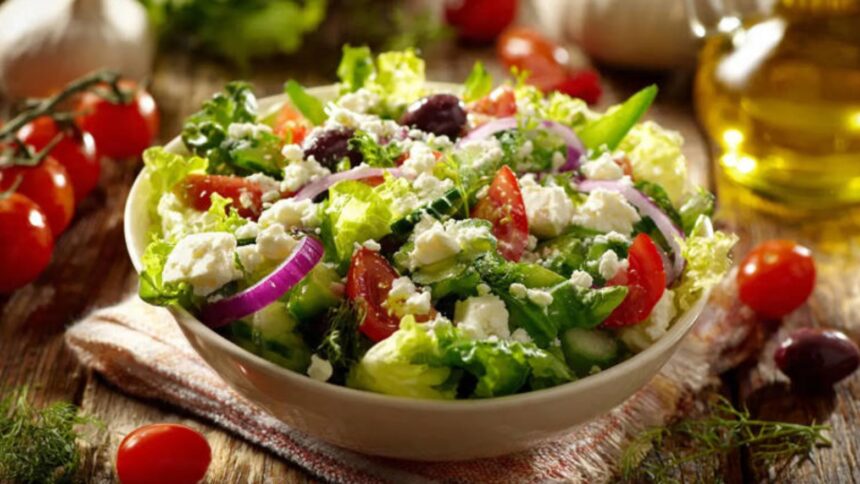 Hunterfly 2026 07 28 192200 Fresh healthy salad bowl with vegetables, chickpeas, seeds, and olive oil dressing.