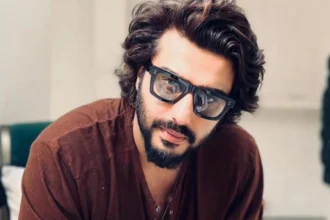 Arjun Kapoor posing at a public event showcasing his luxury lifestyle and celebrity status