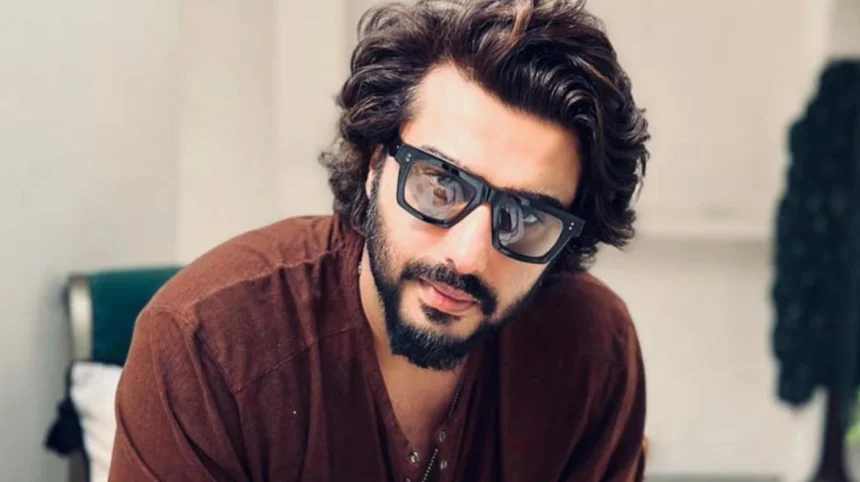 Arjun Kapoor posing at a public event showcasing his luxury lifestyle and celebrity status