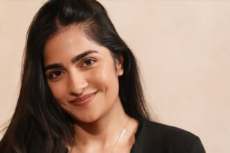 Rukmini Vasanth posing in a stylish black outfit during a recent photoshoot