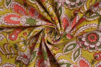Artisan creating Kalamkari artwork using traditional natural dyes and bamboo pen
