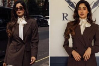 Hunterfly 26 07 21 103454 Janhvi Kapoor wearing a brown pinstripe blazer and ivory trousers at the India vs England ODI match