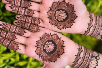 Hands decorated with dark mehendi design after using natural home remedies for a deeper henna stain