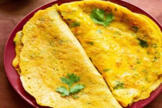 Crispy homemade besan chilla served with green chutney and yogurt