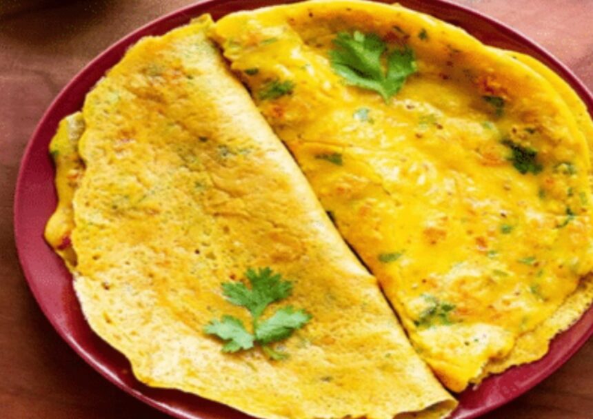 Hunterfly 26 07 28 193835 Crispy homemade besan chilla served with green chutney and yogurt
