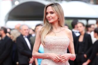Angelina Jolie showcasing one of her iconic red carpet fashion looks.