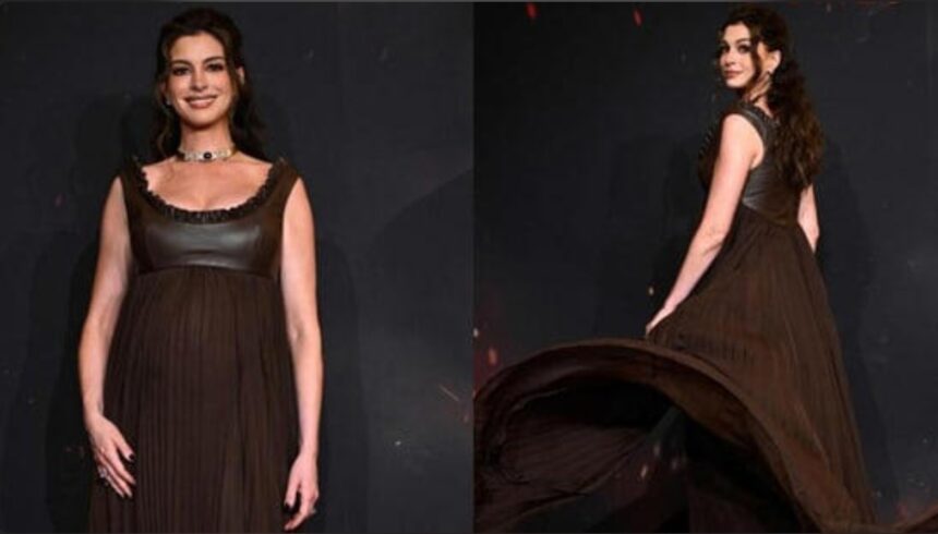 Anne Hathaway wearing custom Louis Vuitton maternity gown at The Odyssey Paris premiere