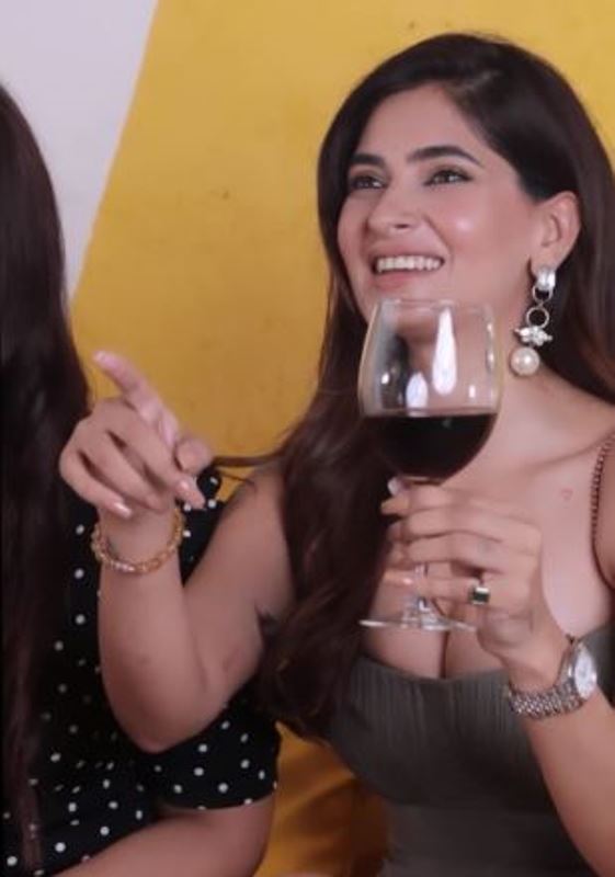 Hunterfly Karishma Sharma holding a glass of wine Karishma Sharma at a Glance
