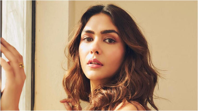 Hunterfly dcfdfdssd Mrunal Thakur inside her luxurious Mumbai residence featuring elegant interiors, a high-rise balcony, and traditional Indian design elements.
