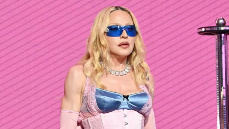 Madonna during a public appearance as reports emerge about her decision not to attend London Pride due to security concerns.