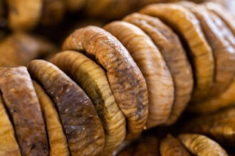Soaked anjeer figs in a bowl highlighting digestive and heart health benefits