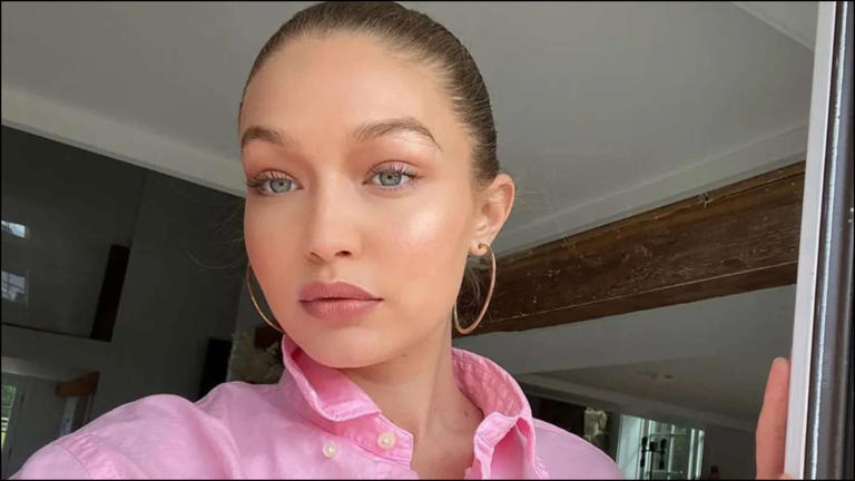 Gigi Hadid wearing a sparkling pink vintage gown at a celebrity event