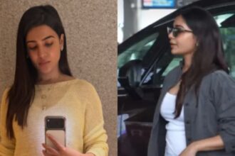 Hunterfly 026 08 02 183119 Pregnant Samantha Ruth Prabhu smiling at the airport while showcasing her baby bump in a comfortable travel outfit.