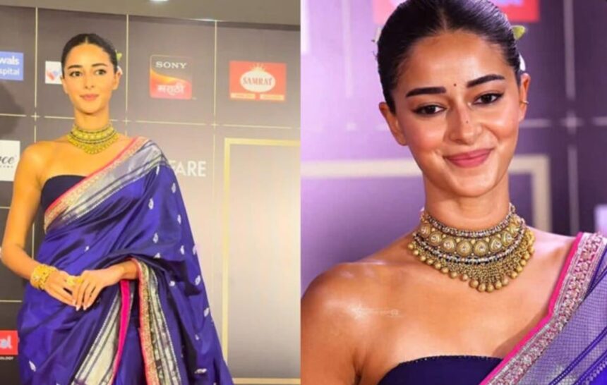 Ananya Panday wearing a royal blue Banarasi saree with a modern strapless blouse at an awards event.