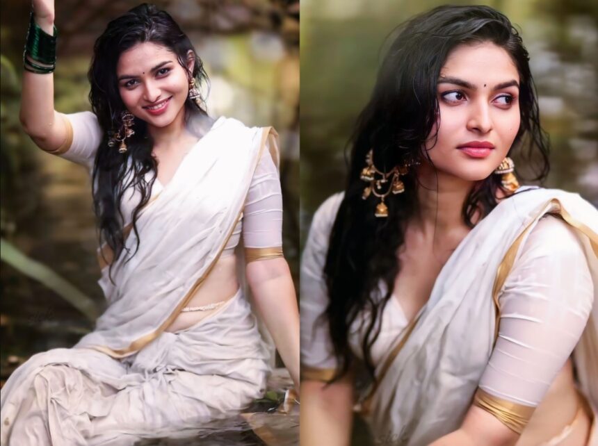 Hunterfly 026 08 07 163149 Kayadu Lohar wearing a white Kasavu saree with gold border during a monsoon-themed outdoor photoshoot.