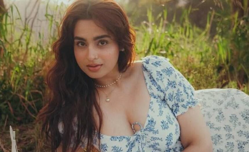 Ayesha Khan poses with a mystery man while showing a diamond ring