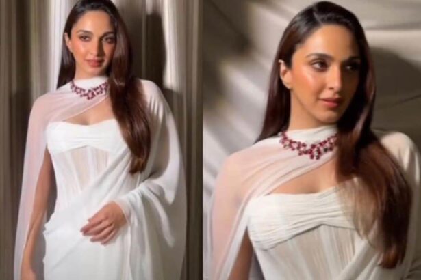 Kiara Advani wearing a white chiffon saree by Manish Malhotra with a 78-carat ruby and diamond necklace.