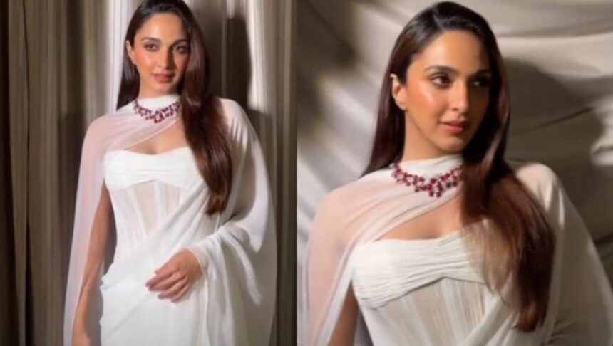 Hunterfly 026 08 28 143452 Kiara Advani wearing a white chiffon saree by Manish Malhotra with a 78-carat ruby and diamond necklace.