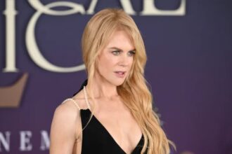 Nicole Kidman wearing a pearl-accented black mini dress at the Practical Magic 2 London photocall