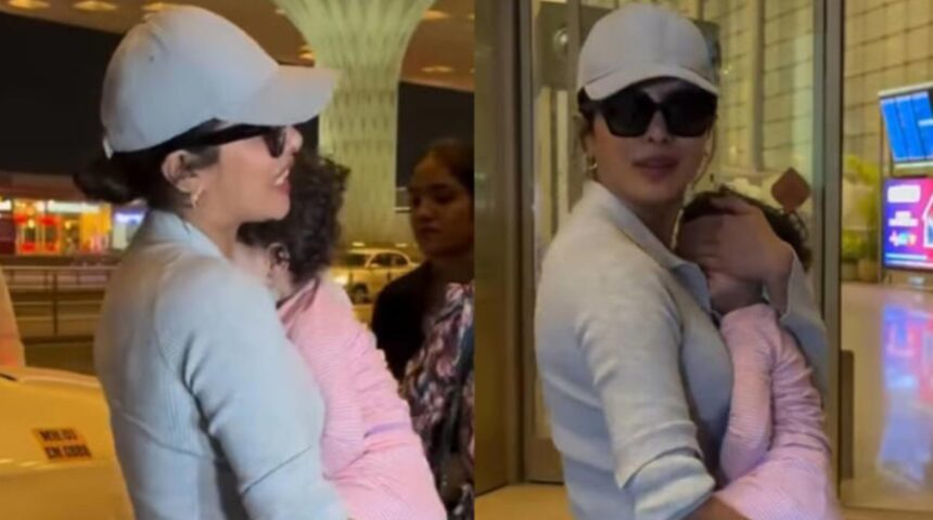 Priyanka Chopra carrying daughter Malti at the airport while interacting with fans.