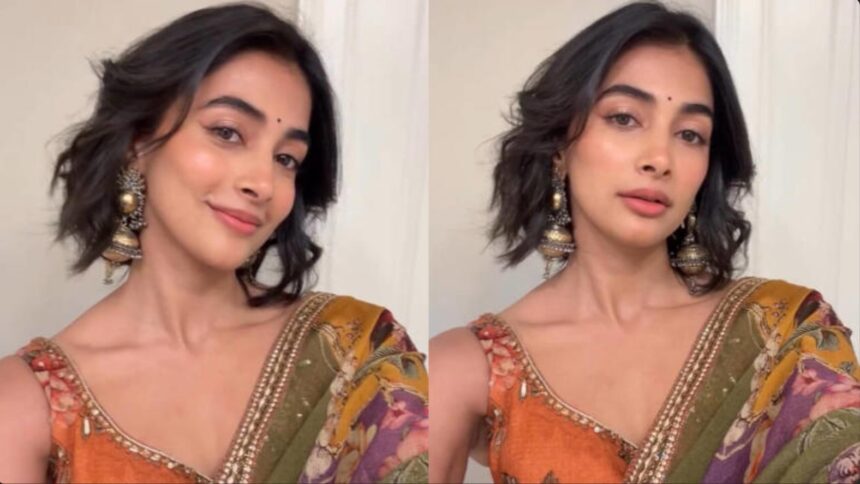 Hunterfly 2026 08 05 122203 Pooja Hegde wearing an olive-green printed saree during a public event in the United States.