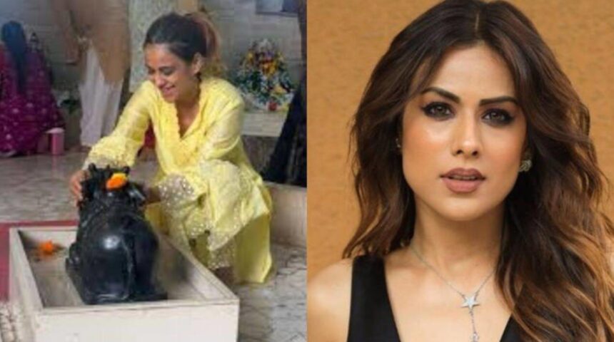 Hunterfly 2026 08 12 140257 Nia Sharma performs prayers during her Sawan temple visit