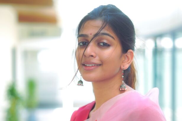 Ananthika Sanilkumar in a pastel pink heart-printed organza saree