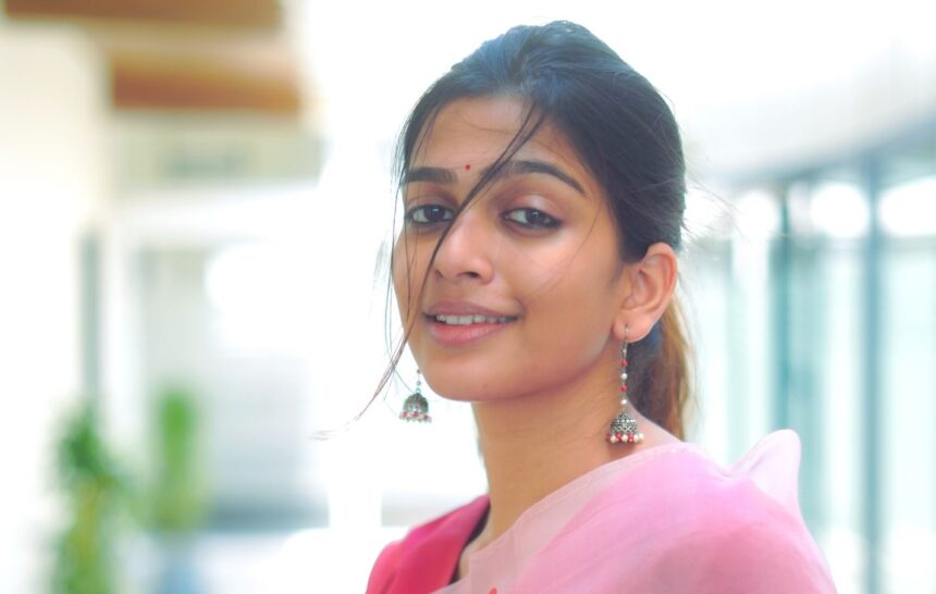 Ananthika Sanilkumar in a pastel pink heart-printed organza saree