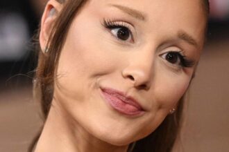 Ariana Grande showing her new collarbone tattoo during her Eternal Sunshine tour