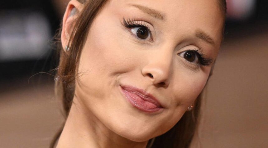 Ariana Grande showing her new collarbone tattoo during her Eternal Sunshine tour