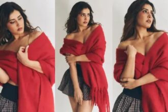 Raashi Khanna poses in a glamorous short skirt and red shawl during a fashion photoshoot