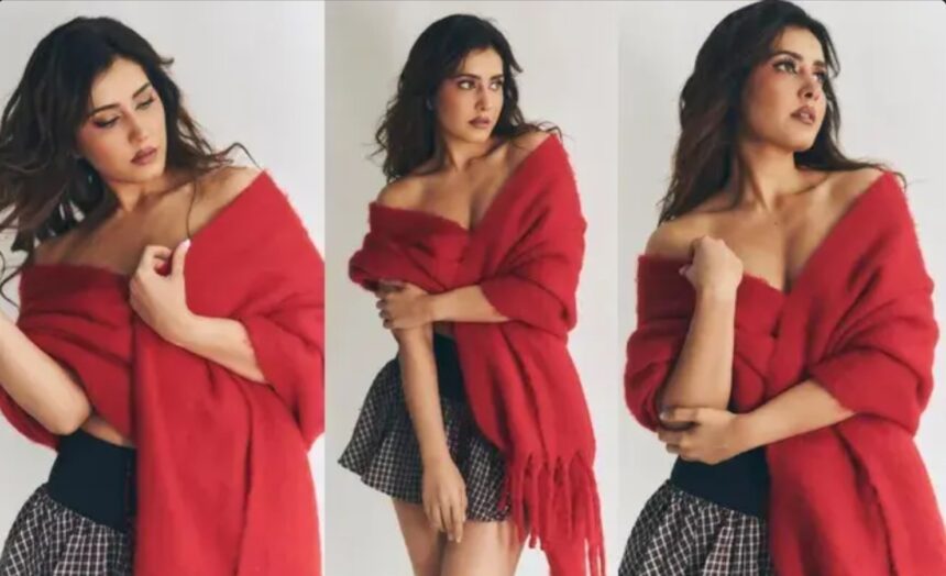 Raashi Khanna poses in a glamorous short skirt and vibrant red shawl during a fashion photoshoot