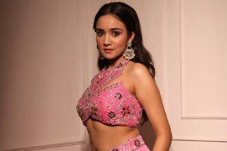 Ashi Singh wearing a pink co-ord set with colourful floral embroidery and halter-neck styling