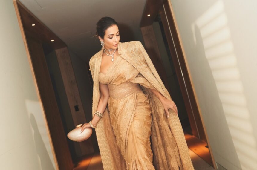 Hunterfly 2026 08 31 100519 Malaika Arora wearing a champagne-gold saree with a dramatic statement jacket at the Melbourne Film Festival