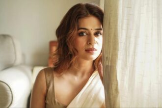 Shraddha Das wearing a cream beige saree with minimal jewellery