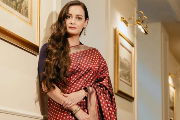 Dia Mirza wearing her mother's red Banarasi silk saree at the Operation Safed Sagar launch