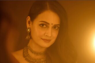 Hunterfly t 2026 08 05 191124 Dia Mirza wearing a handwoven Shruti Sancheti silk satin sari at the Operation Safed Sagar trailer launch