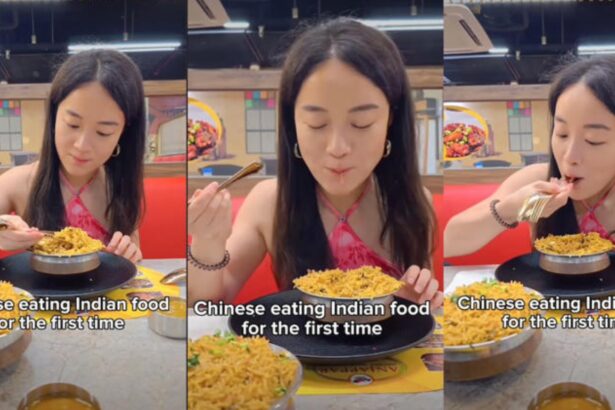 Chinese woman trying biryani for the first time while using a spoon like chopsticks