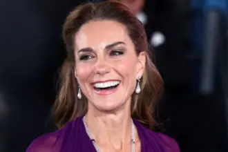 Kate Middleton laughs after her gown is accidentally stepped on at the Digger premiere in London