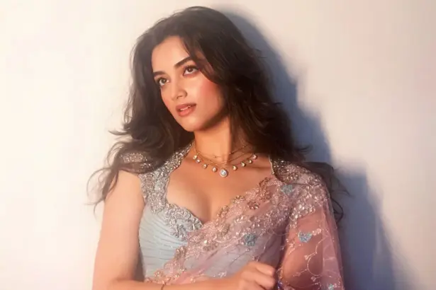 Bhagyashri Borse in a sheer pink saree with powder-blue embellished blouse