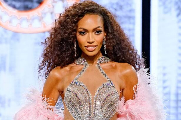 Justus Kelley after being crowned Miss USA 2026 in her sparkling gown and feathered cape