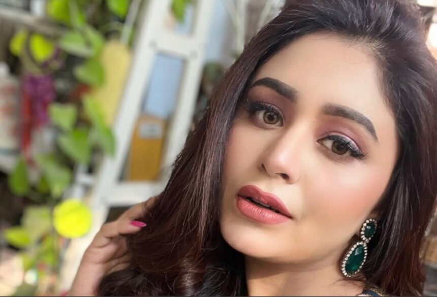 Hunterfly 2026 09 12 092822 Ritabhari Chakraborty in a turquoise bikini top and red floral sarong by a pool