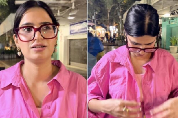 Woman puts on a pink shirt after feeling uncomfortable during a Connaught Place outing