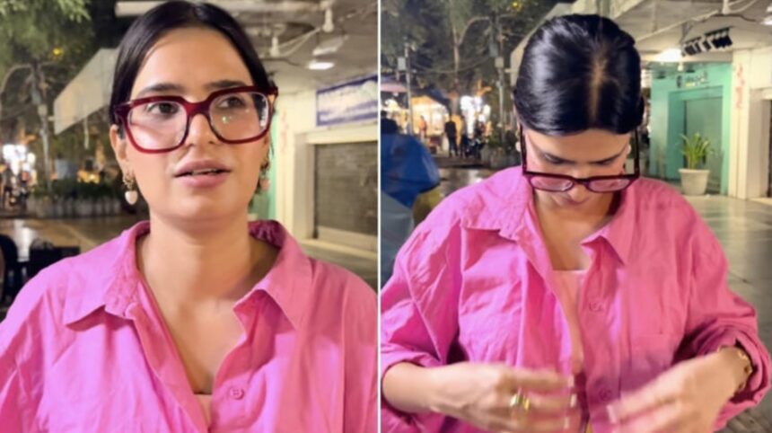 Hunterfly 2026 09 17 113632 Woman puts on a pink shirt after feeling uncomfortable during a Connaught Place outing