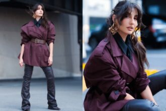 Urban power dressing with burgundy structured jacket and black leather-look trousers
