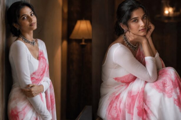 Woman wearing a blush pink and white floral saree with statement jewellery