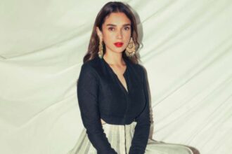 Aditi Rao Hydari in a black-and-ivory kurta with a bold red lip