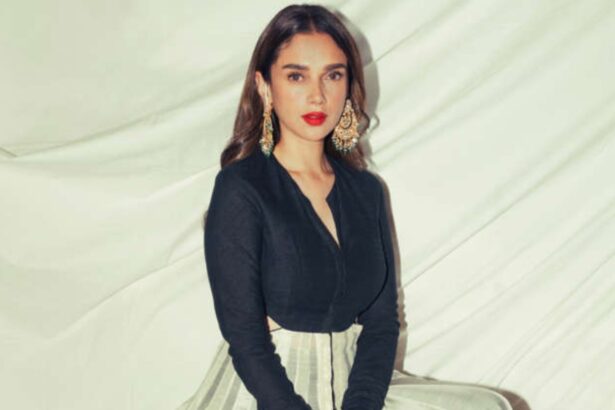 Aditi Rao Hydari in a black-and-ivory kurta with a bold red lip