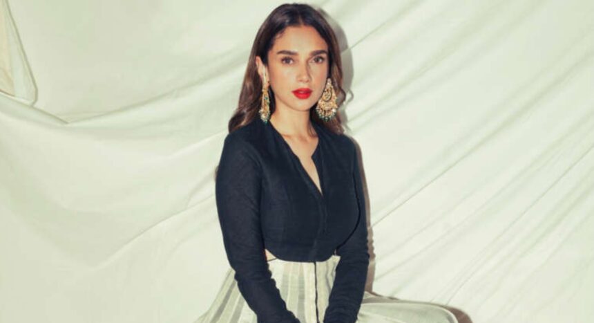 Aditi Rao Hydari in a black-and-ivory kurta with a bold red lip