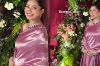Mahira Khan in a glossy pink satin saree with a diamond and ruby choker